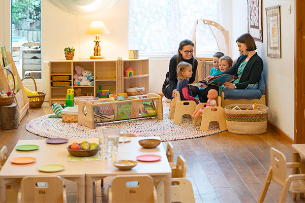 Childcare staff playing with children